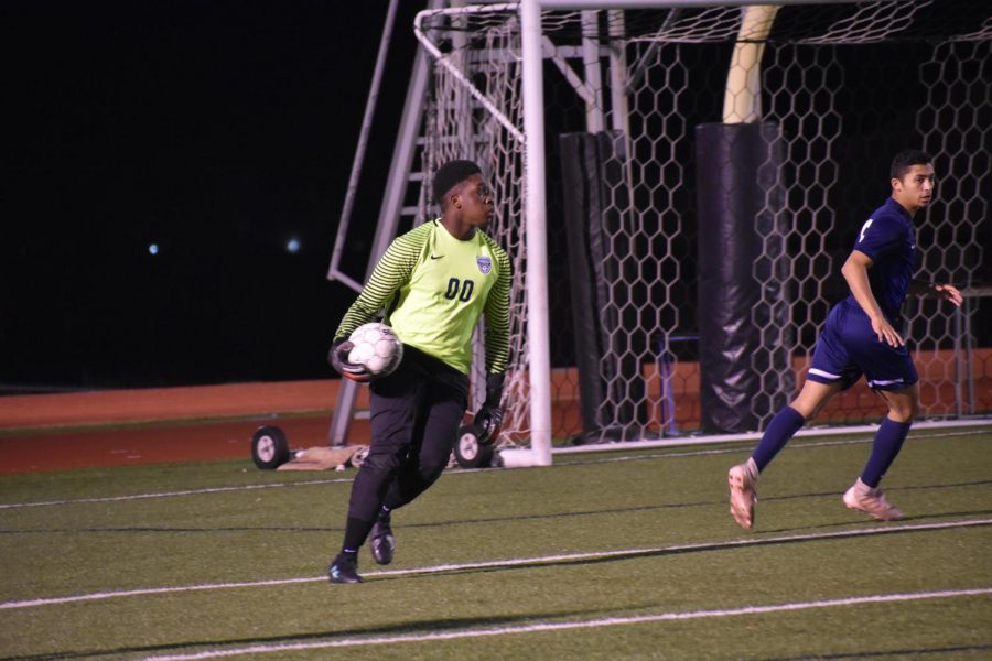 He%E2%80%99s+a+keeper+%2F%2F+Hot+on+his+feet%2C+junior+varsity+goalie+Maxwell+Quaye+scouts+the+field+for+his+teammates+during+their+game+against+Denison+High+School.+The+team+won+7-0+and+finished+the+regular+season+with+an+undefeated+record.+%E2%80%9CWinning+game+after+game+carried+our+momentum+and+gave+us+confidence%2C%E2%80%9D+Quaye+said.%0A
