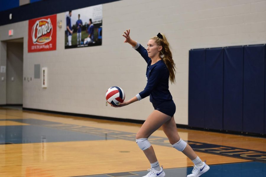 First+come%2C+first+serve+%2F%2F+Serving+the+ball+to+the+opposing+team%2C+sophomore+Morgan+Haaland+plays+against+Mesquite+High+School+Sept.+5.+Junior+varsity+defeated+Mesquite+3-0.+