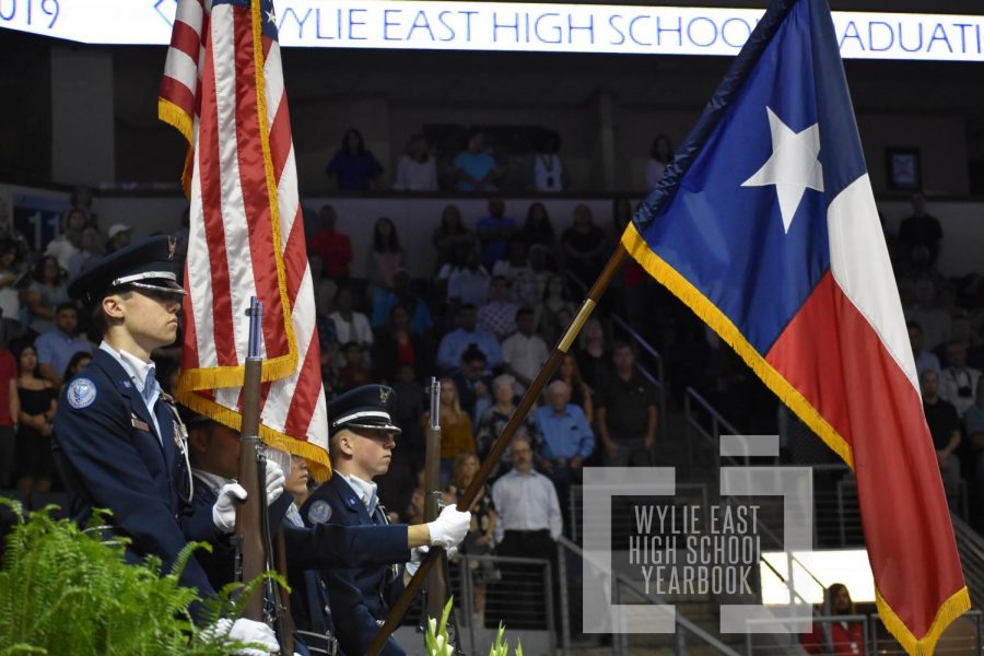 O say \\ JROTC color guard participated in the graduation ceremony by presenting the colors for the singing of the National Anthem.