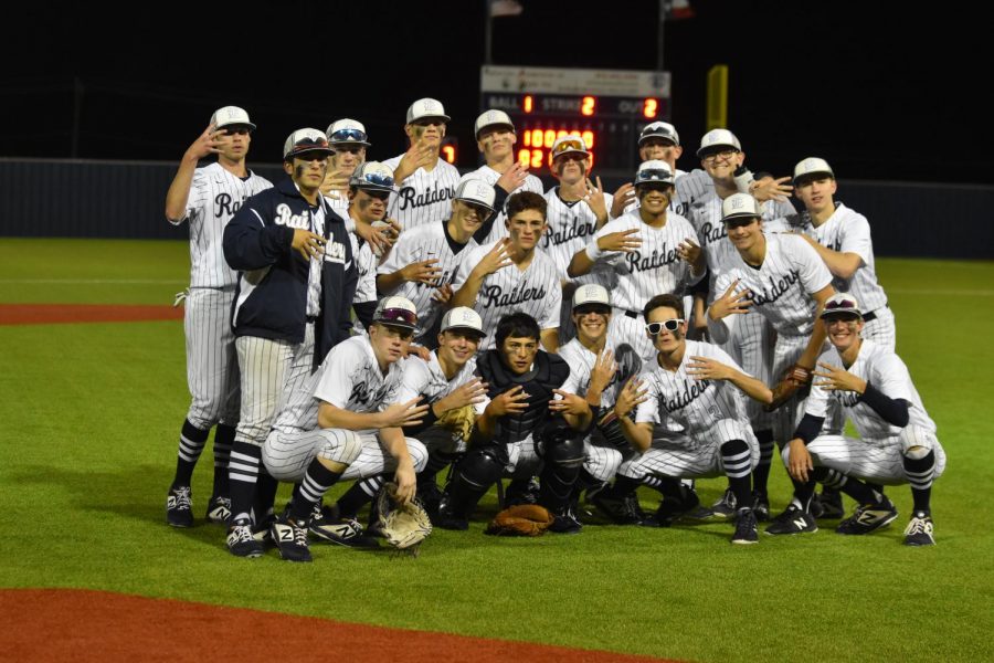 The varsity baseball team gathers for a team picture after defeating RL Turner at Allen High School May 16.