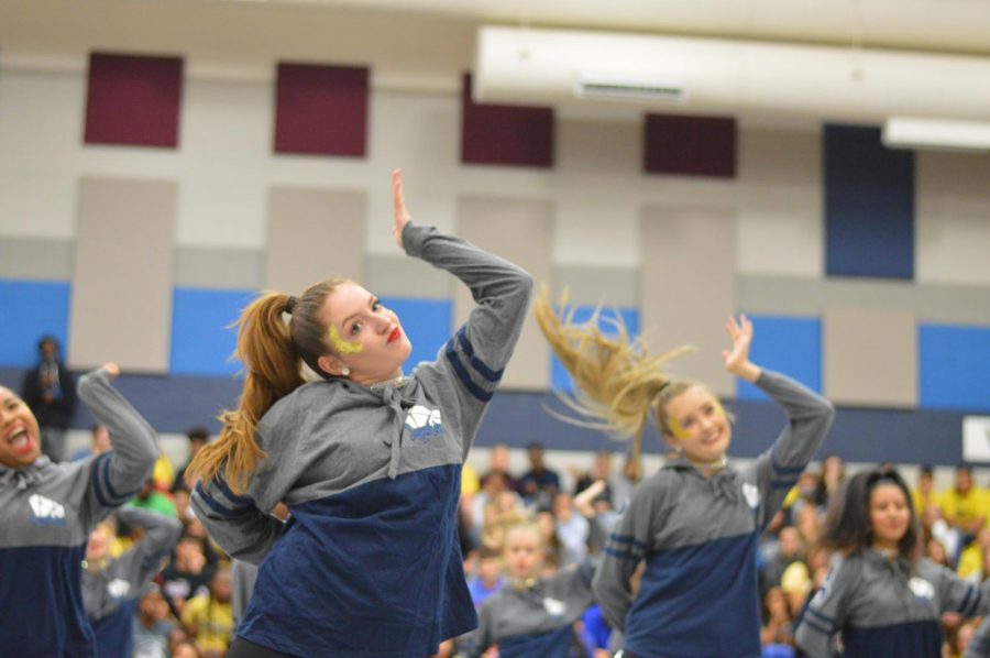 During the first pep-rally of the school year, senior Addie Orr performs with her Sapphire team. Orr is a National Merit semi-finalist.