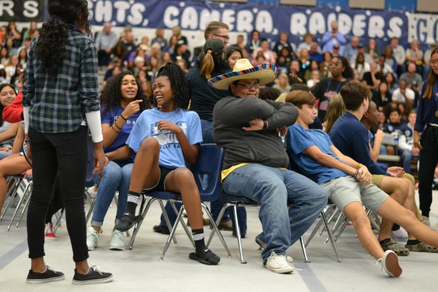 Musical mayhem \\ Participating in an intense game of musical chairs, students from each grade level attempt to snatch the last chair before the music ends at the homecoming pep rally Oct. 18. “My strategy was to booty bump whoever sat in the chair I was going to sit in and therefore always have a chair,” sophomore and player Luis Lopez said. “Also, the sombrero gave me a boost because no one could get near me.” 
