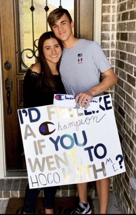 All smiles \\ Sophomore Connor Phelps surprises his girlfriend, freshman Rylie Flaherty, with a homecoming proposal. “I was really mad and I didnt want to go outside, but Im glad I did,” Flaherty said.
