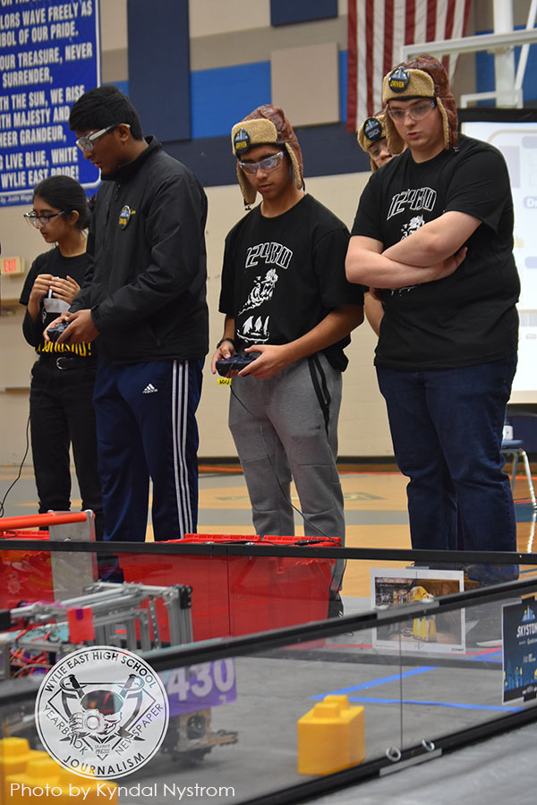 Back for more \\ Beginning the game portion of their second competition in a row, juniors Esteban Figueroa and Joseph Morgan drive the robot for team 12430. The team won three awards and advanced to regionals Jan. 11.