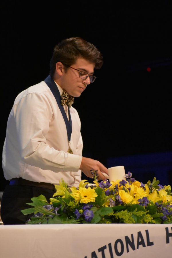 Shining bright \\ Senior Jaron Harbison helps lead the National Honor Societys induction ceremony. Sometimes it is harder to do the right thing than it is to do the bad thing, but it pays off in the end, Harbison said.