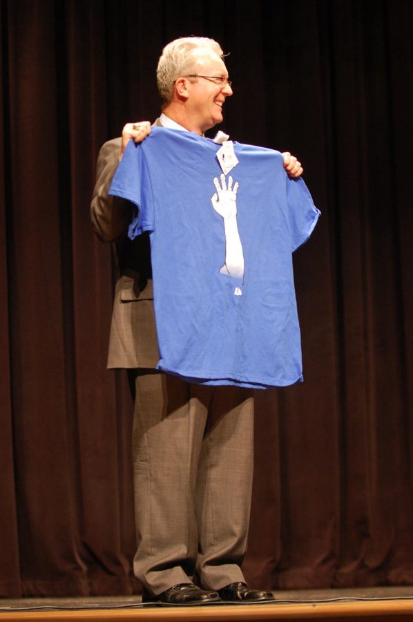 Baseball fan \\ Mr. Williams shows his support for the Texas Rangers at an awards assembly in 2011.