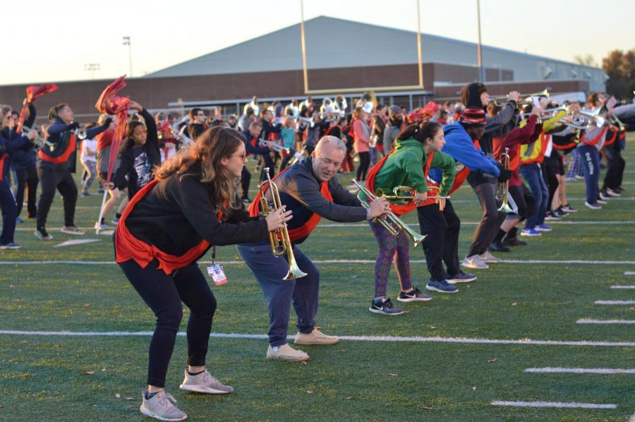 On point \\ Standing in for a band member, Principal Williams participates in the annual March My Spot hosted by the Pride of the East and Sapphires in 2018.
