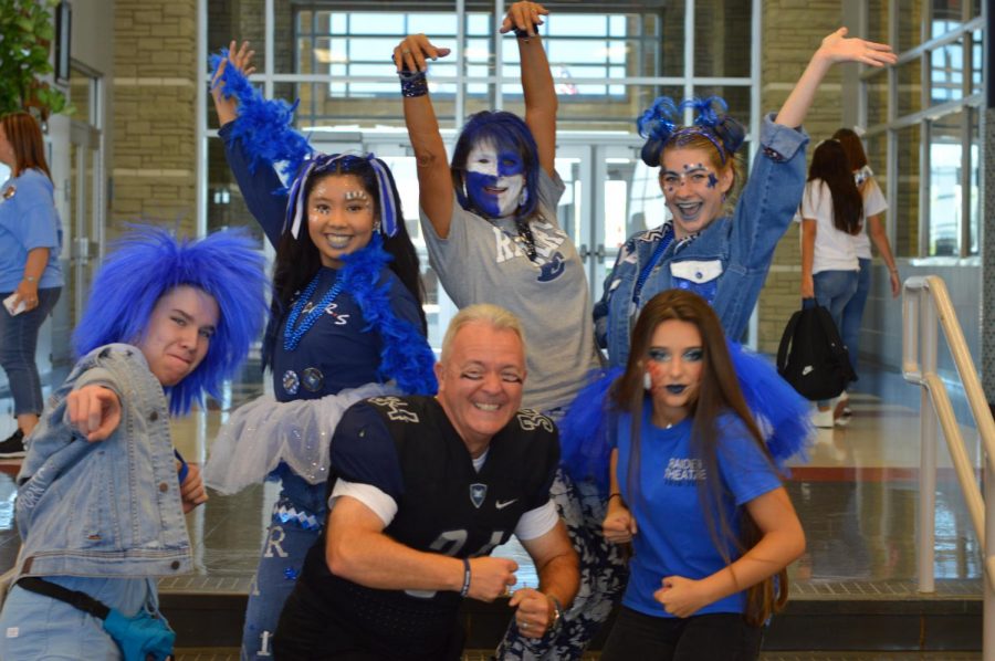 Bleeding blue \\ Mr. Williams poses with the winners of the Ultimate Raider Contest in 2019.