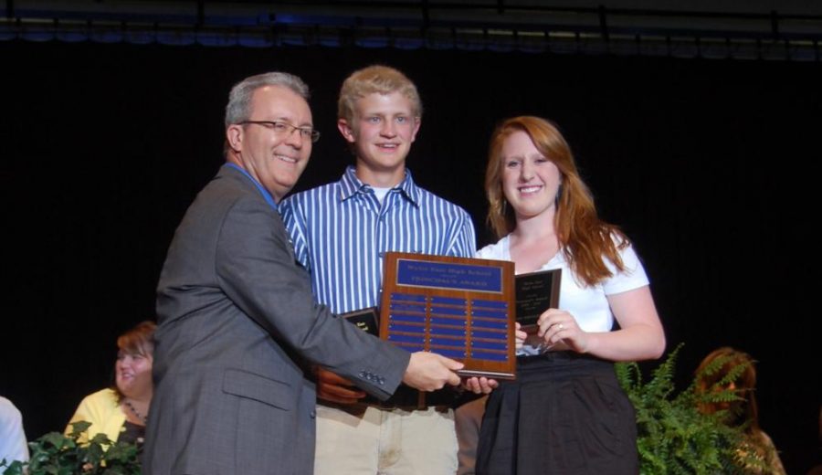 In the beginning \\ Principal Mike Williams presents alpha class members Chance Grantham and Cassi Springfield with the principal’s award at the  first-ever senior awards ceremony in 2012.