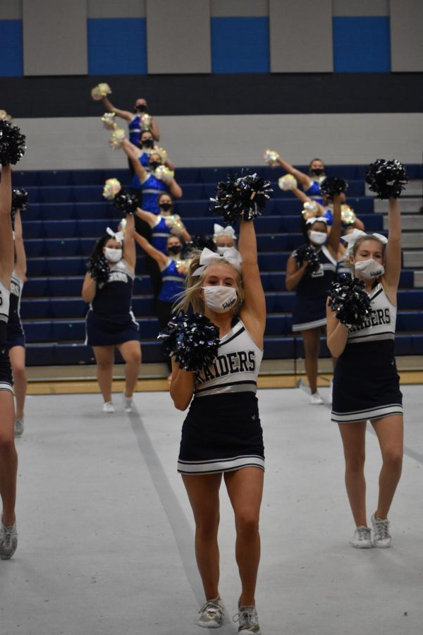 Cheer up \\ Cheer co-captain Ashtyn Arp brings her school spirit to peform at the pep rally with her teammates. “My favorite part was just the fact that we were all together and doing what we love again,” Arp said.