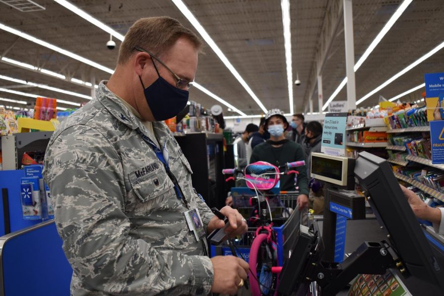 JROTC is coming to town \\ Checking out at the Wylie Walmart Colonel Brooks McFarland shows JROTC the true meaning of Christmas. Every year, members of JROTC cadets go class-to-class collecting money from their peers and teachers to purchase gifts for the Wylie Way Christmas Angels. “We were able to raise more money this year, which was really cool because we could give even more presents out,” C/1Lt TJ Garvin said.