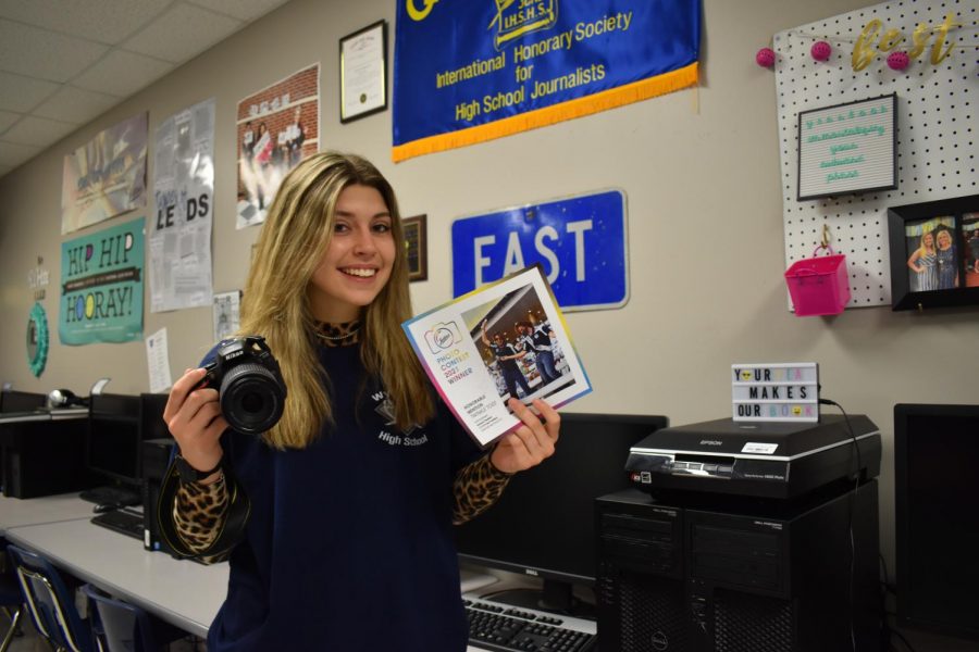 Passion pay off \\ Sophomore Torrance Thedford poses with the photo she took that gained a national award in Jostens 2021 Photo Contest. I was so excited to win for something I love to do, Thedford said.