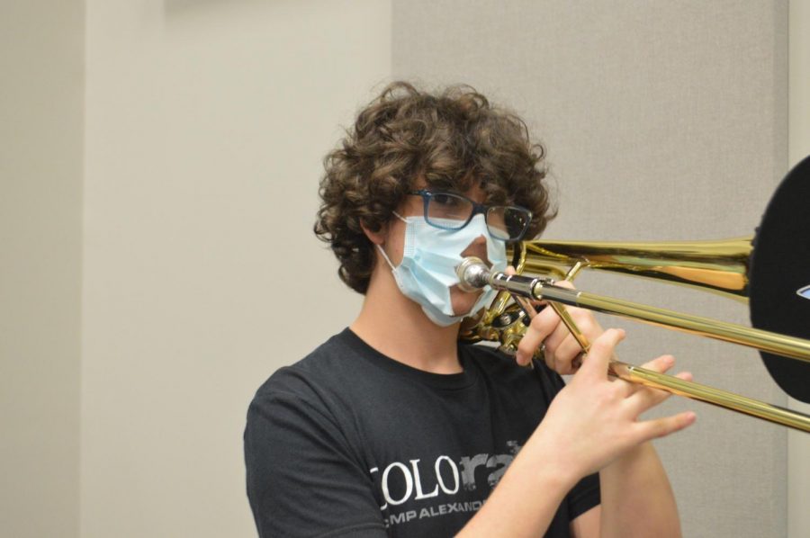 Making music \\ Improvising, sophomore Jeremy Kvale performs a solo on the Bass Trombone for the Jazz piece: Chili Today, Hot Tamale Nov. 5. “My favorite part about Jazz Band is everything, but especially playing low notes really loud and playing basslines,” Kvale said.
