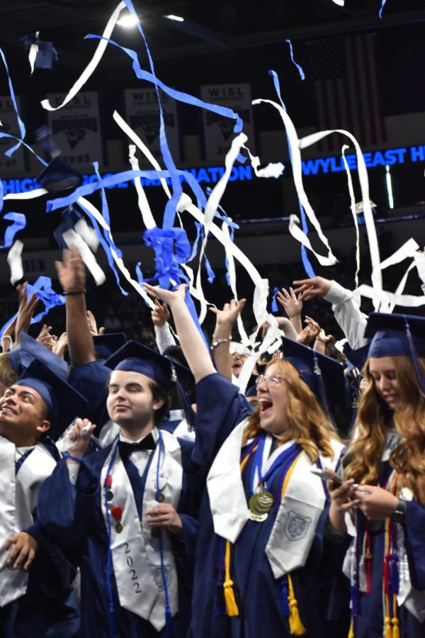 Streaming live \\ Seniors Logan Koonce and Abby Koehler celebrate the end of the graduation ceremony. The Class of 2022 walked the stage to receive their diplomas at the Allen Event Center May 28.
