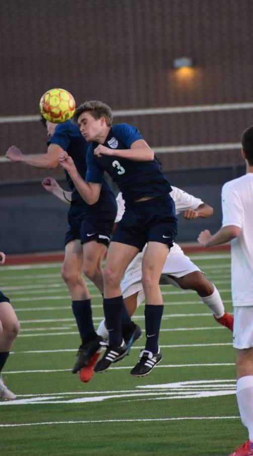 Heads up \\ After the goalie punts, sophomores Hayden Wren and Brayden Tran use their heads to deflect the ball Jan. 18. JV beat Lake Dallas 3-1.  
