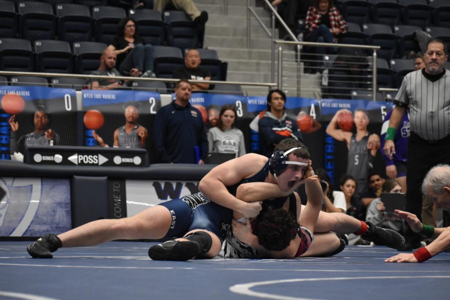 Take+him+down++%5C%5C+Fighting+his+opponent+in+the+district+tournament+Feb.+2%2C+junior+Colby+Feece+becomes+a+regional+qualifier+along+with+junior+Ryan+Lobato%2C+junior+Robert+Samano%2C+junior+Paul+Ouane%2C+senior+Ty+Jarvis%2C+sophomore+Isaac+Flores%2C+senior+Xavier+Cole+and+junior+Landon+Nguyen.+The+wrestling+team+hosted+the+tournament+and+the+team+placed+4th+overall.+