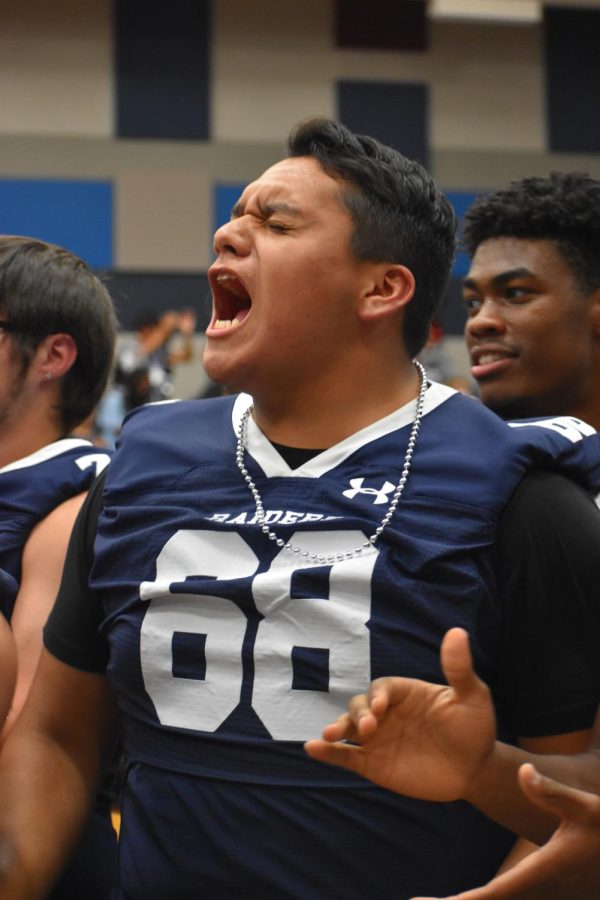 Senior screams \\ Senior Lee Garcia sports his varsity football jersey for the game day pep rally Oct. 21. My favorite thing about the pep rally was seeing everyone hyped about the game and believing in our ability to win, Garcia said.