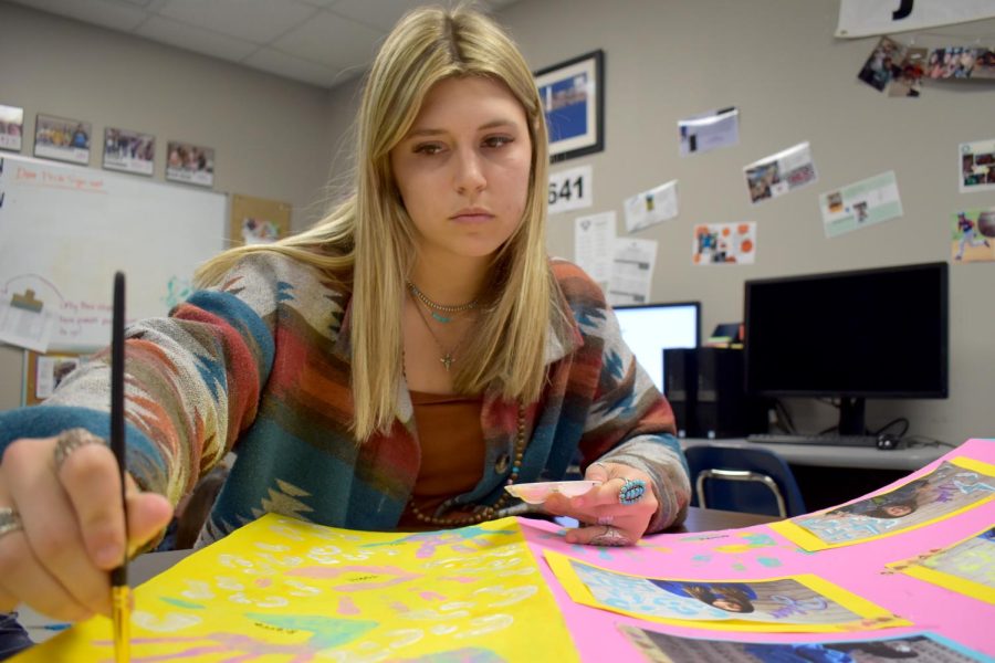 Painters touch \\ Sophomore Tori Thedford finishes up some touches on her teams poster to participate in the “Best Trifold” contest for the yearbook and newspaper banquet April 26. “I feel remorse for the teams about to lose,” Thedford said.