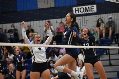 On cloud 9 \\ Playing in the varsity volleyball game, freshman Amy Hernandez and the team celebrate her kill against JJ Pearce Aug. 17. “I like playing with the girls on varsity. That’s where I feel the best fit,” Hernandez said. Varsity won 3-0. 