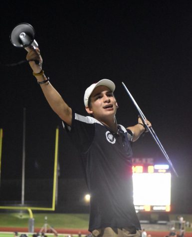 Spirit leader \\ Senior Everett Vasquez leads the student section at the varsity football game against Mt. Pleasant Aug. 26. Be at the football games and pep rallies, Vasquez said. Get involved in school events, be loud and excited at the school events you attend. Don’t be embarrassed to put yourself out there.