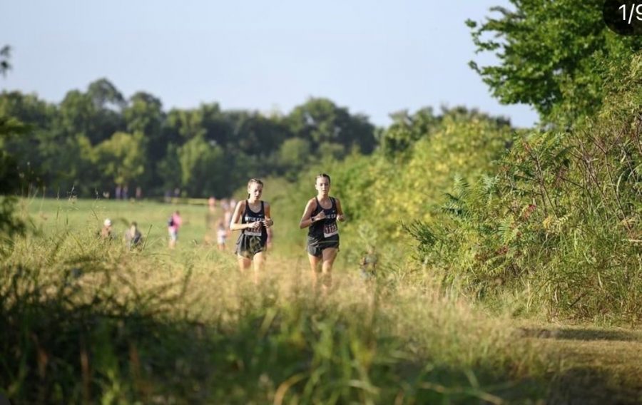 Running mates \\ Sisters Faith Seddig and Evy Seddig both run cross country. “It’s really fun to have a partner to do everything with, but also stressful because you want to beat her,” Evy said.