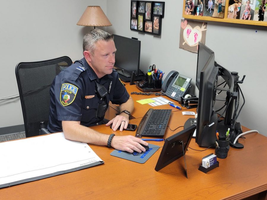 Undercover \\ In his new office, School Resource Officer Michael Stewart works on doing his job and answering emails. Before this, Officer Stewart has worked at several schools around the district, including Wylie High and Cooper Junior High. 
