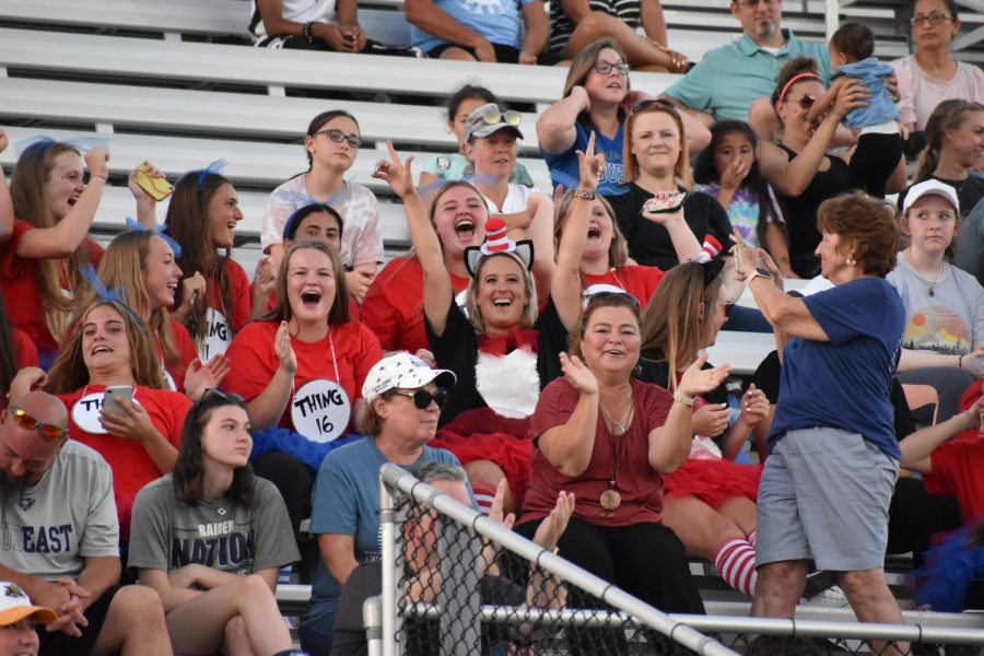 Top of their game \\ The softball team celebrates winning the homecoming float competition Aug. 30. Soon theyll be off the bleachers and on the field.