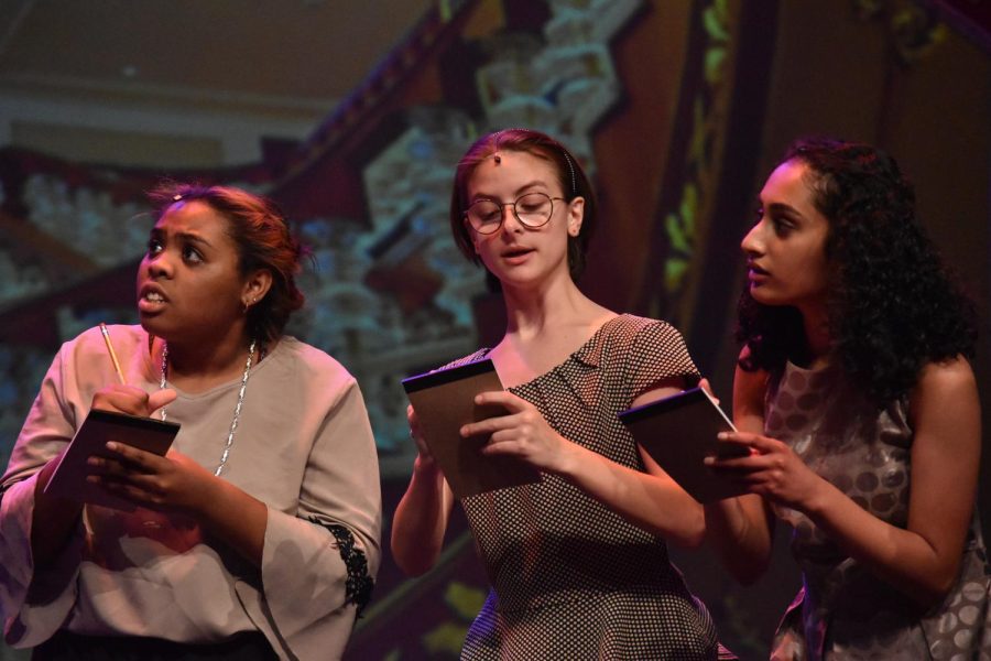Practice makes perfect \\ Performing towards the audience, junior Madi Shavers and seniors Meredith Simmons and Naomi Jacob act out one of their scenes during a dress rehearsal before their upcoming show Anastasia.