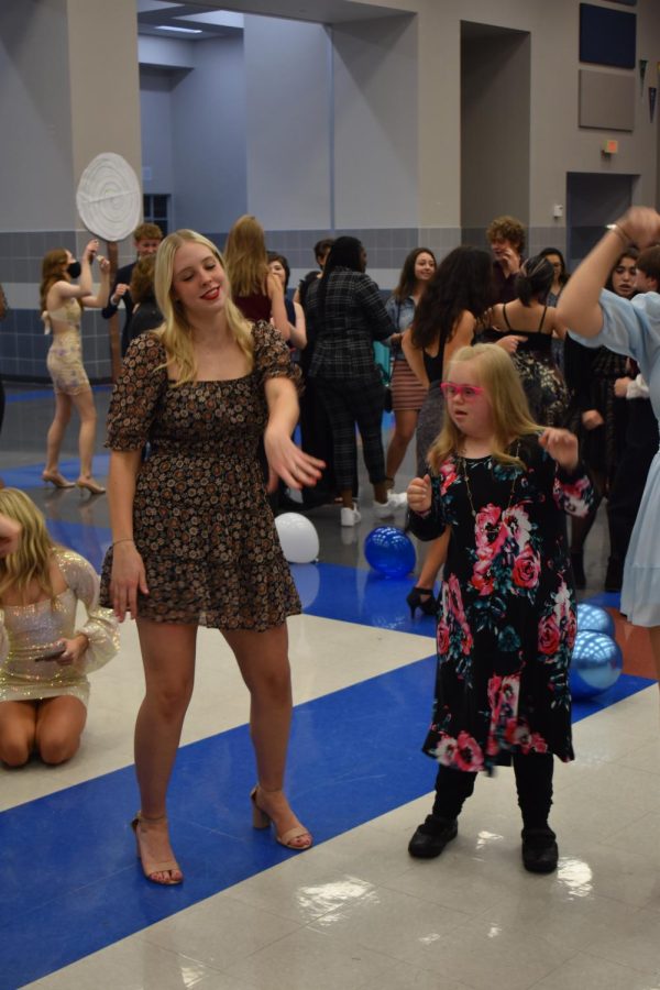 Bust a move \\ Music plays while junior Preslee Drake dances with a special needs student at the Winter Wonderland dance hosted by the NHS. “The kids were so excited to be dancing and hanging out with all the other students and I was glad I got to be a part of it,” Drake said. 
