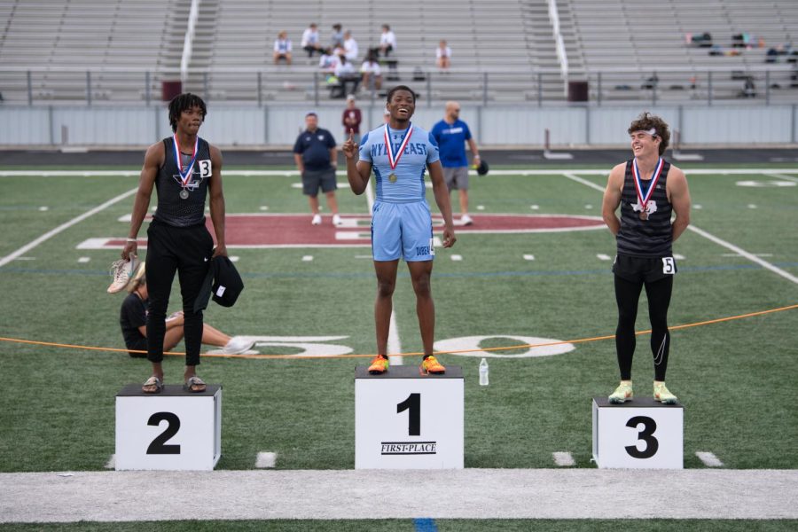 First aint the worst  \\ Beaming with his first place medal, junior Charis Jackson poses for a photo to mark his first place win in the 400M during the Area track meet April 21.