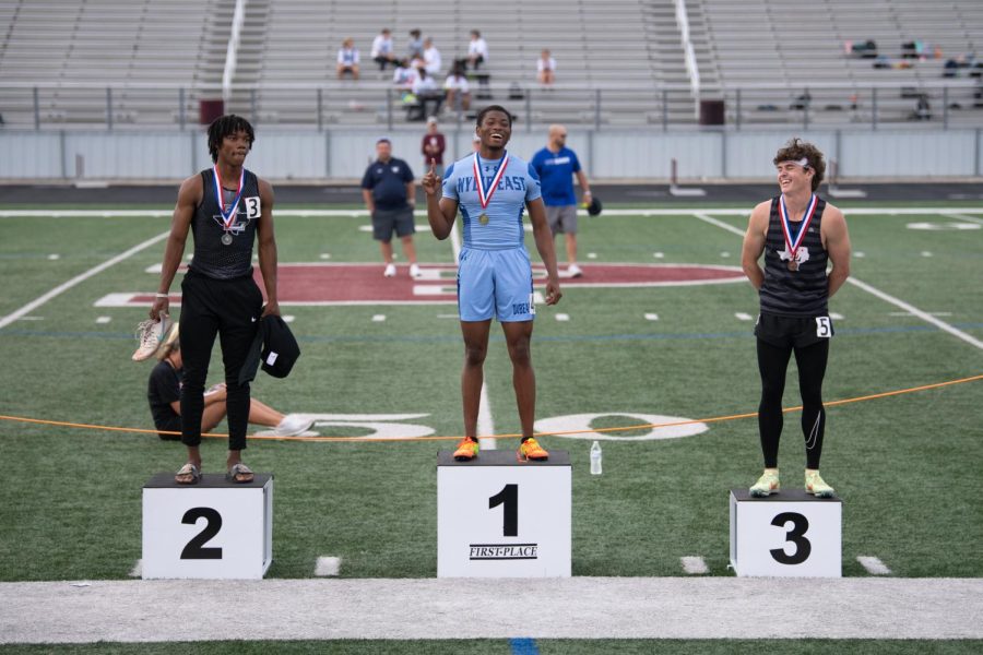 First aint the worst  \ Beaming with his first place medal, junior Charis Jackson poses for a photo to mark his first place win in the 400M during the Area track meet April 21.