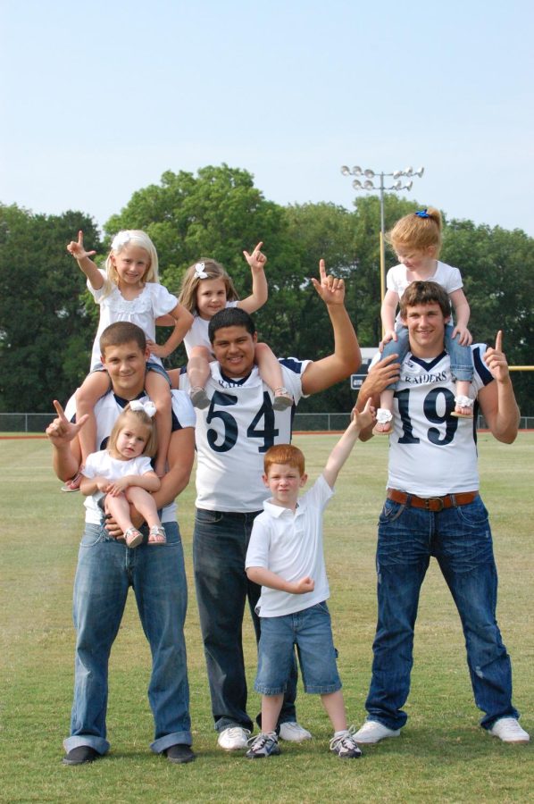A few of my teacher friends and I purchased an ad in the football program. We had our favorite football players pose with our kids for it.