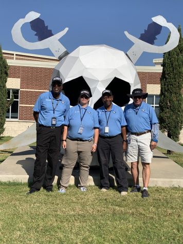 Standing tall // Looking tough, the schools security team poses for a picture on Oct.5. Having new rules this year has made it where the team has better communication than any year before, Ernest Nelson said.
