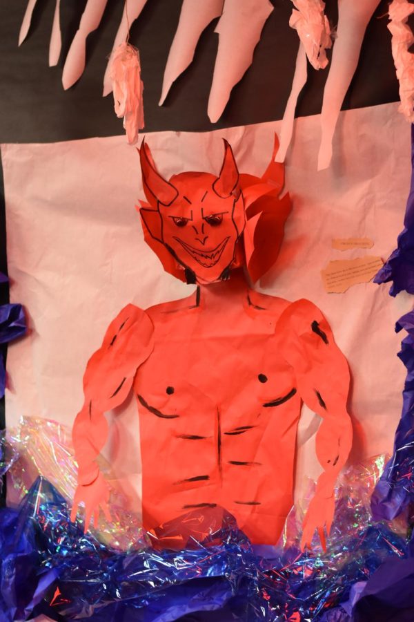 To hell and back \ Watching over the Humanities II sixth period student’s project, a life-size depiction of Satan towers over the ninth circle of hell. In Dante’s interpretation of hell, Satan has three heads and is half-way stuck in ice.