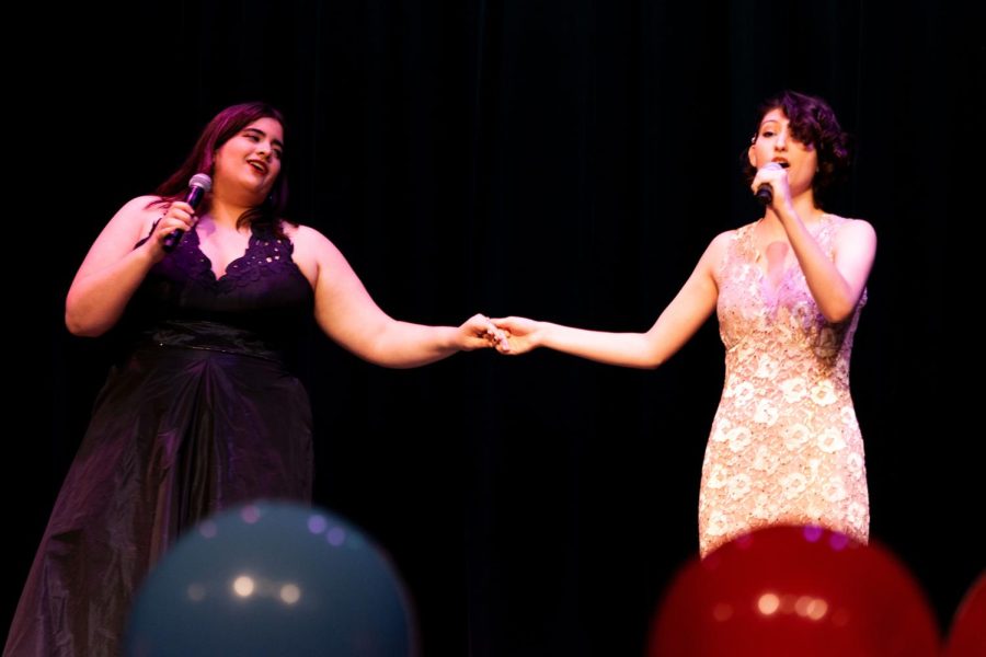 Hand in hand \\ Singing the famous duet, Duo de Fleurs, seniors Lucy Ramirez and Carolyn Childrey perform at the talent show Mar. 22. Performing in the talent show was like showing off to people what we, the performers, could do,  Ramirez said. I also loved being able to get to know more people because of the different acts. I met my friend Antwon Anderson through the talent show over past years, and it really is just a fun thing to do if you want to put yourself out there.