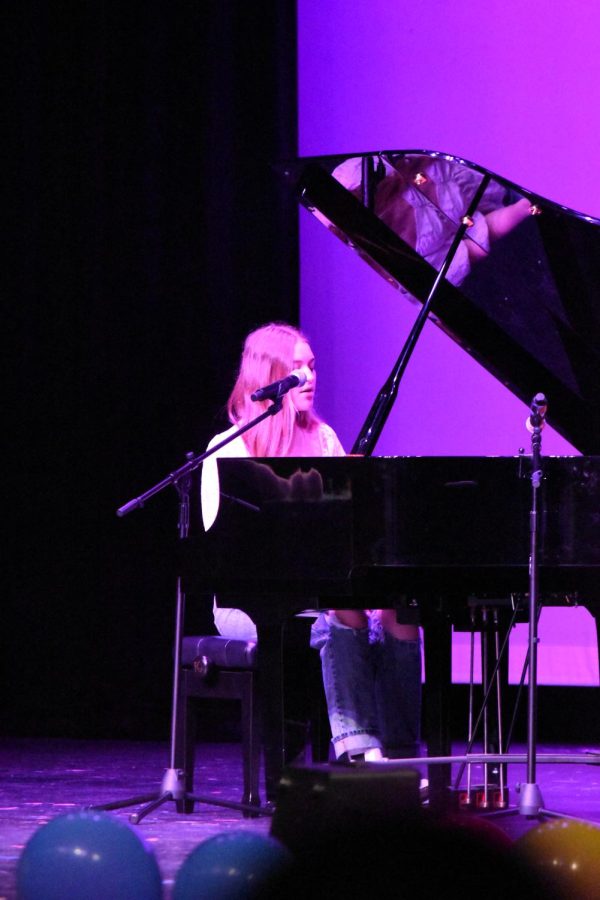 Reaching for the stars \\ Performing Teenage Mind by Tate McRae, freshman Brylee Blair sings and plays piano for Raiders Got Talent Mar. 22. 
