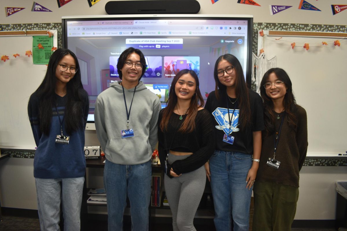 Smile For The Camera \\ Student Officers Fiona Nguyen, Caden Ly, Sophia Luu, Jennifer Nguyen and Alex Tran host the first ever Asian Student Association meeting in order to spread Asian awareness and culture. I am really excited to start a new club and spread awareness about Asian culture, Luu said.