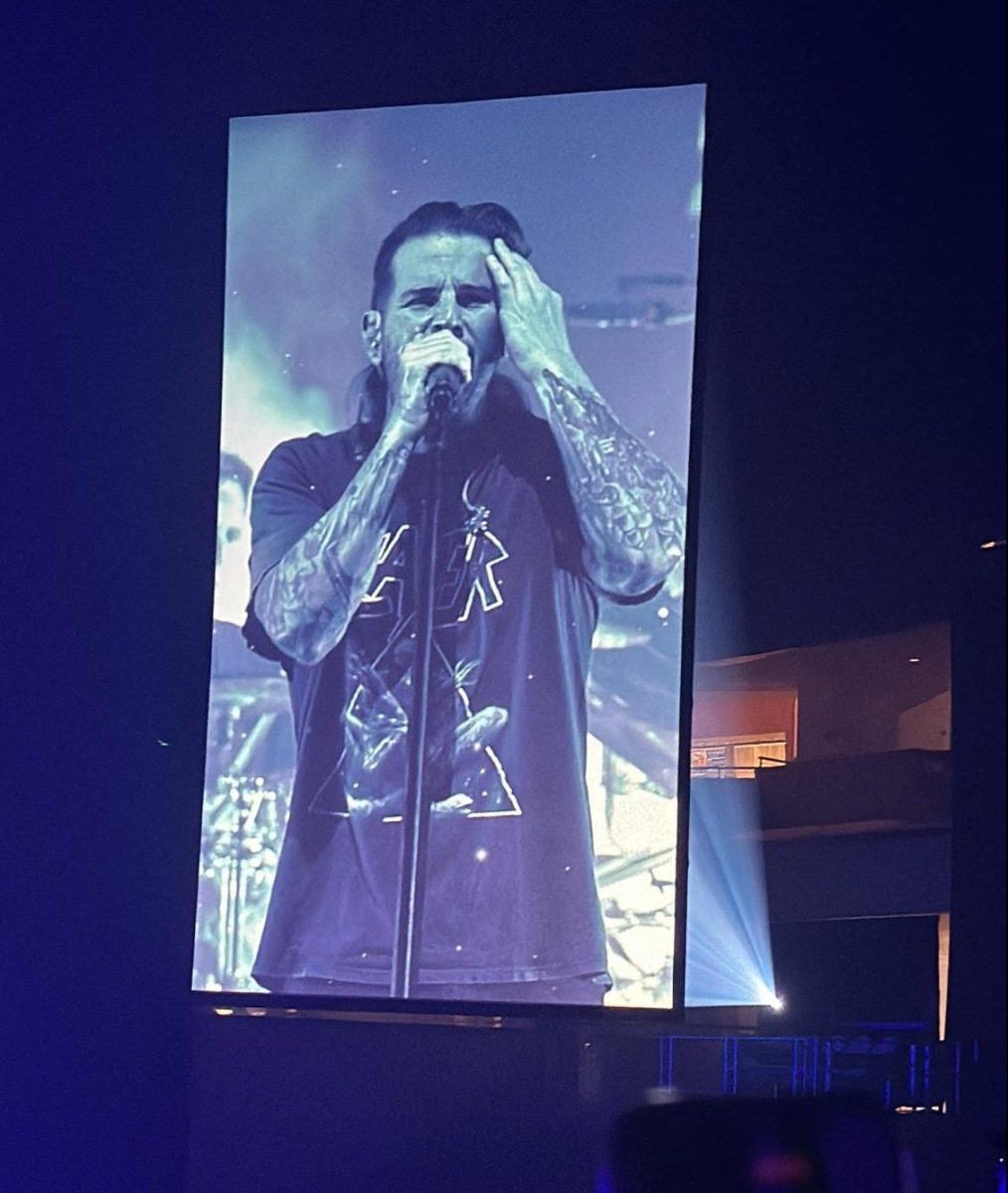 Take the time to listen \ M. Shadows performs Buried Alive in front of 14,000 people. Buried Alive is one of their popular songs from the album Nightmare, and the song is about people being buried alive under their emotions after bottling them up for ages.