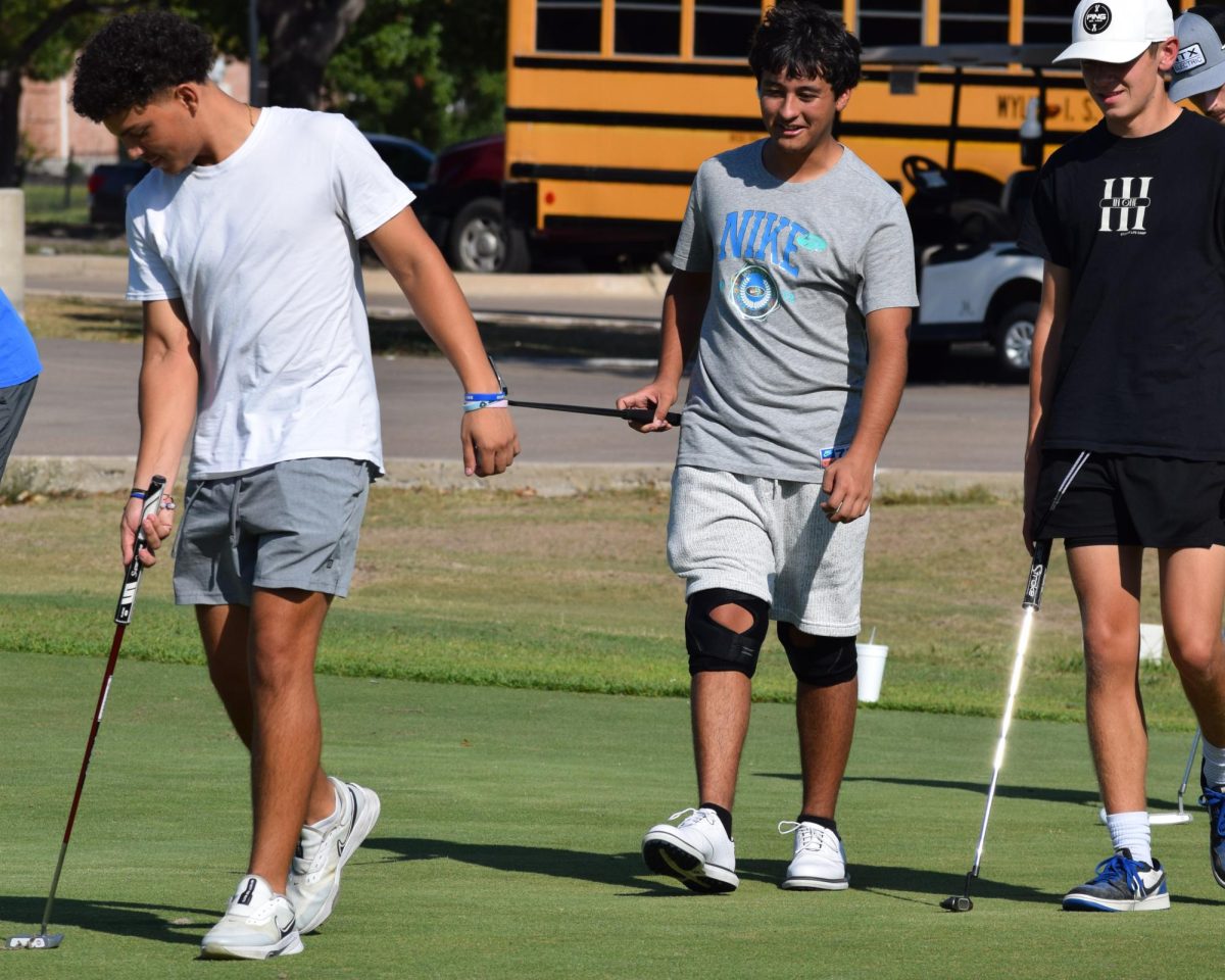 Golfin’ off // Several players of the varsity golf team walk across the course during  afternoon practice. The team was all smiles finding out about their regional qualification. “The team was very, very excited. Everybody was very proud of each other, whenever we qualified,” senior Jalen Gimenez said. 