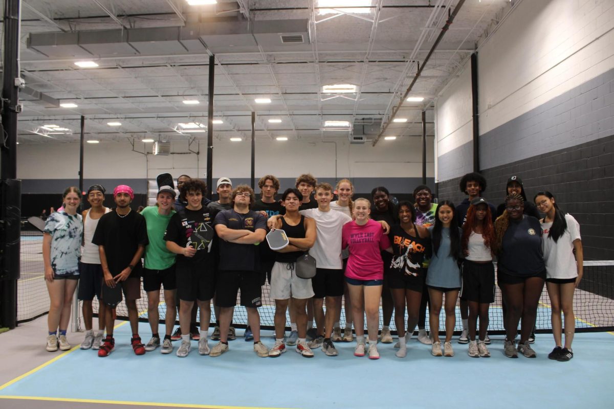 Perfect Play \ Pickleball club members pose together after hosting their first group get together over the summer. “It's exciting to get to do a club about it and have a community for it,” Co-founder Cailyn Corley said.
