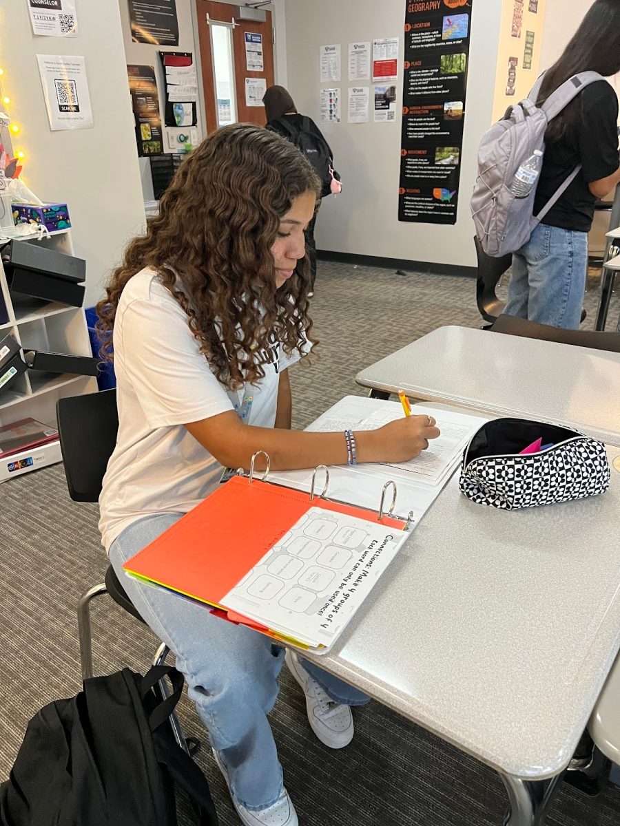 On the ball \ Sophomore soccer player Laila Young studies for her AP World History exam. “This is my most difficult class but I'm determined to get better at it,” Young said.