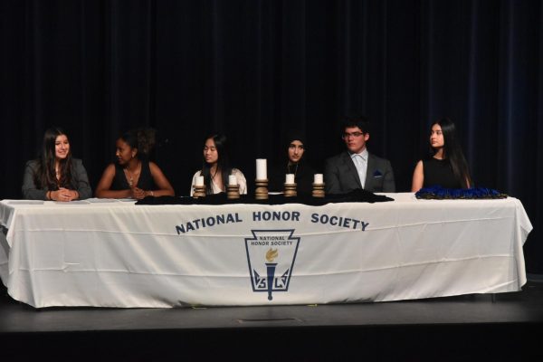 Presidents Danielle Alvarez, Eliana Tamrat, Amanda Lu, Safa Ali, Joshua Stone and Daisy Rodriguez light the candles for each pillar of National Honor Society. Each president said a small speech then lit the candle memorially. “We were super excited for this year's NHS inductions,” Rodriguez said.